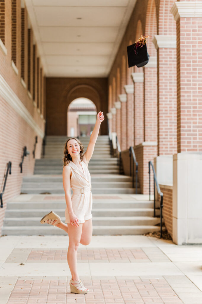 Texas State graduation photos cap toss inside UAC area