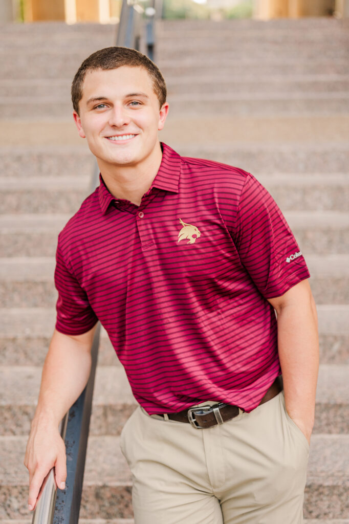 Standing at Alkek steps for his Texas State University Portraits