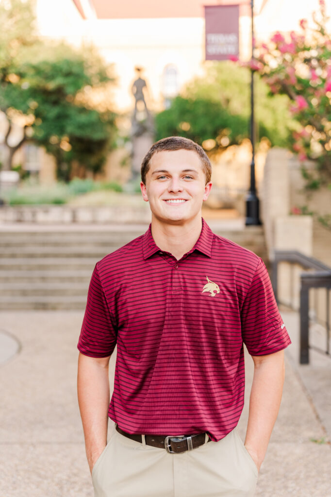 In front of Old Main for his Texas State University Portraits