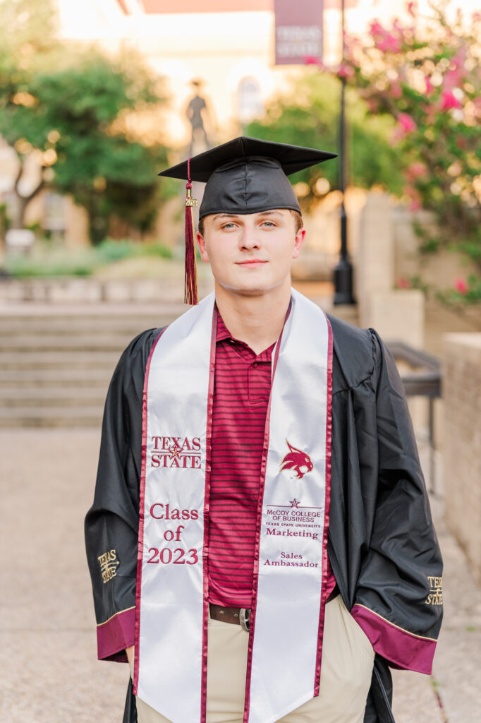 In front of Old Main for his Texas State University Portraits