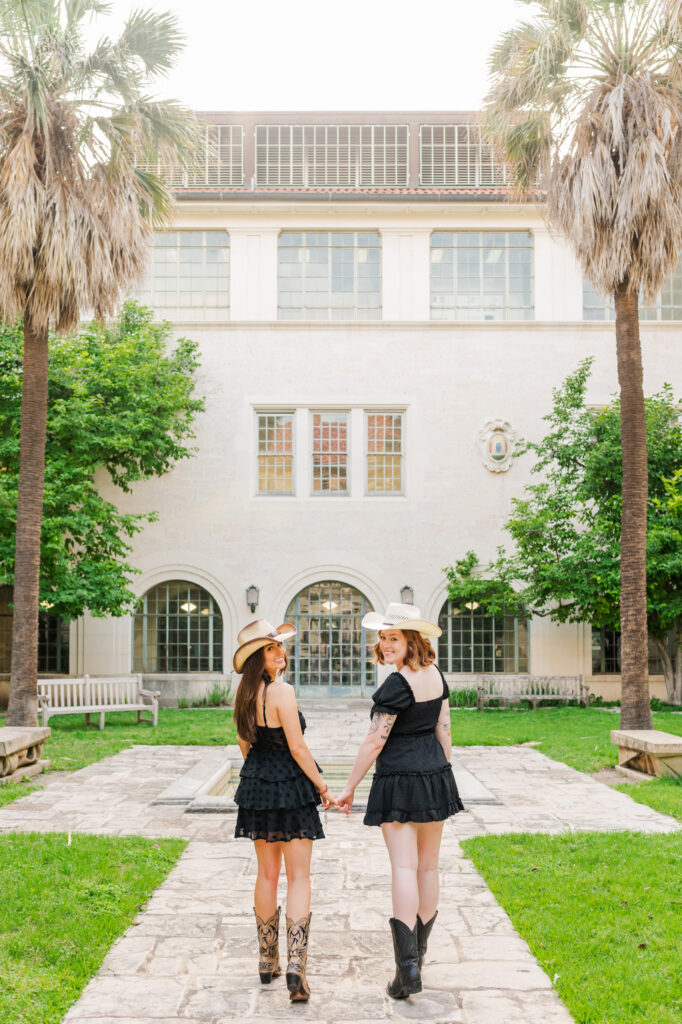 Friends walking away at UT Austin Architecture garden