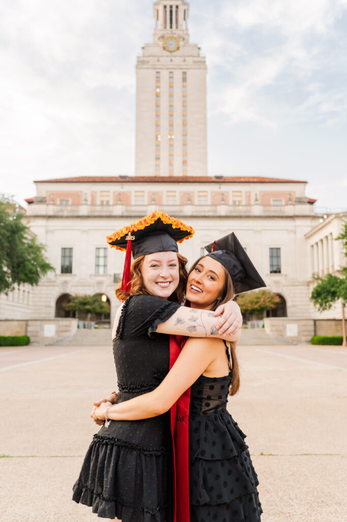 UT Austin Friends hug in front of UT tower