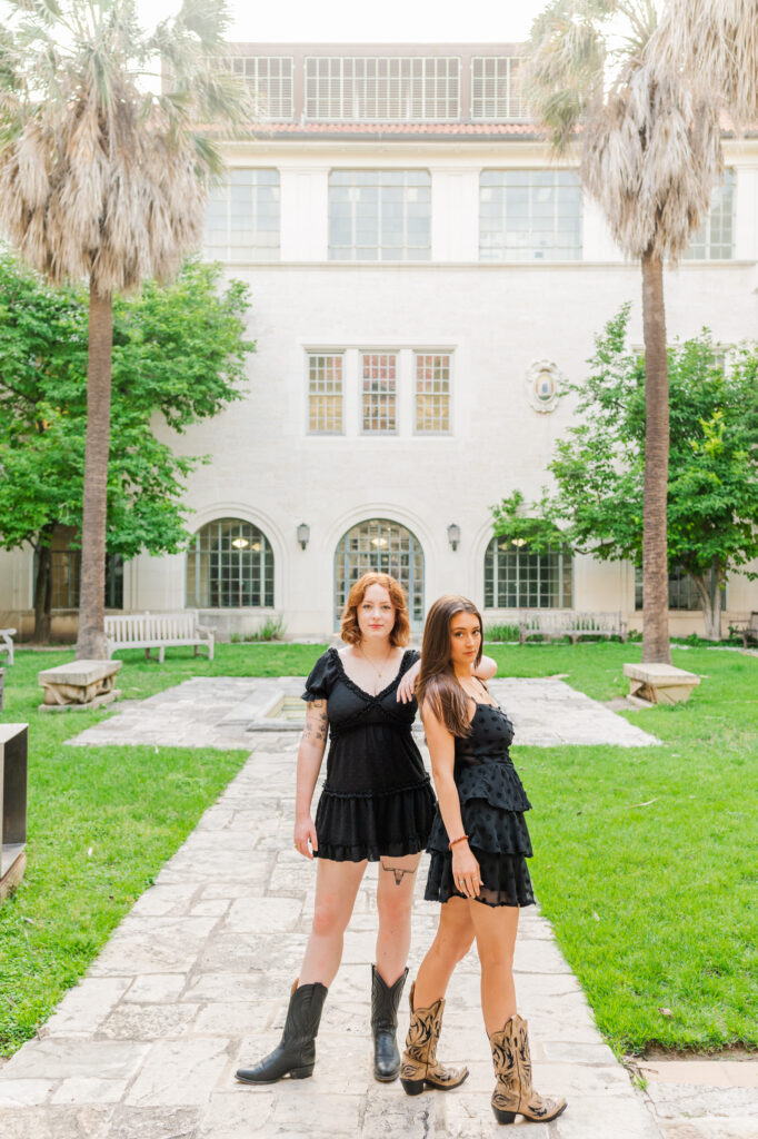 Graduates posing for their UT Austin graduation session