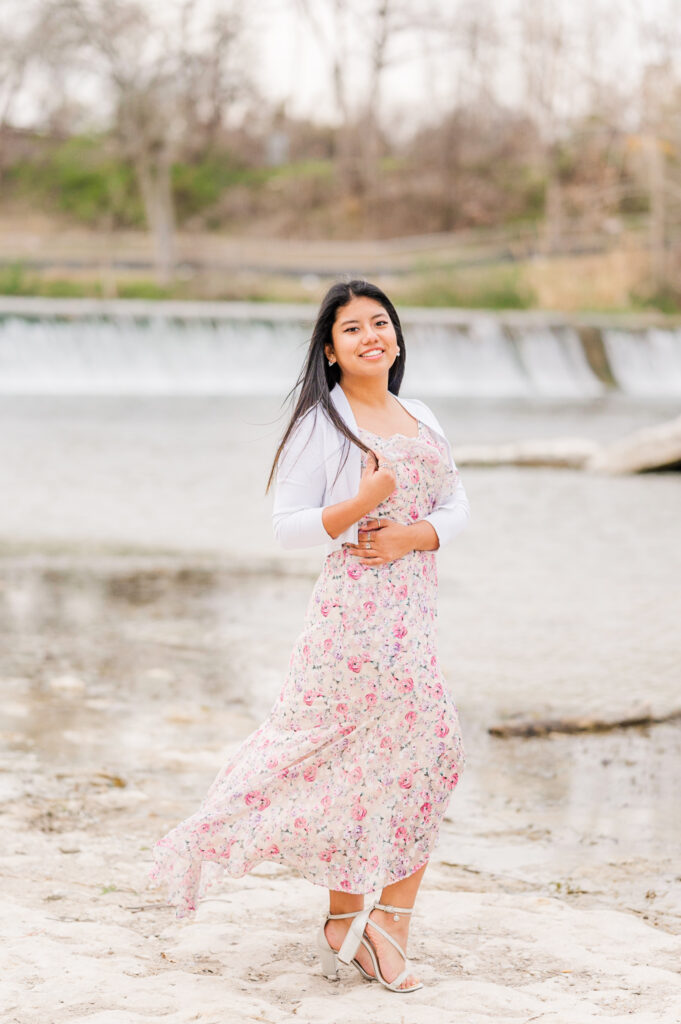 Posing in the water below Faust Street Bridge for her senior session 