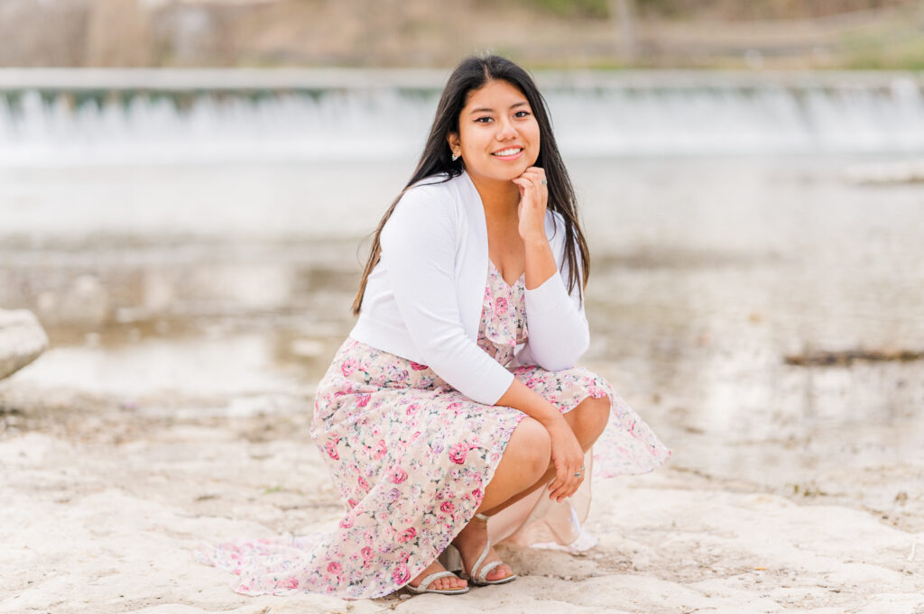 Posing in the water below Faust Street Bridge for her senior session 