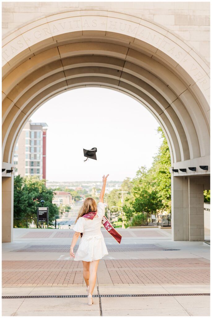 Cap toss for their Texas State University  grad photo