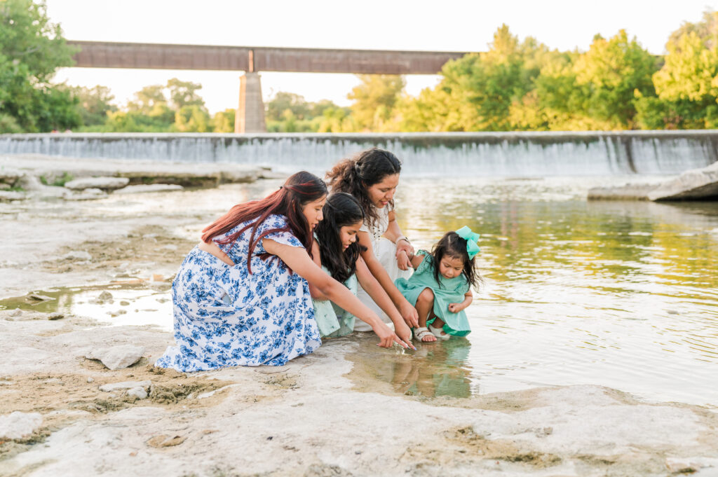 Candid portraits of mom with kids under Faust Street Bridge