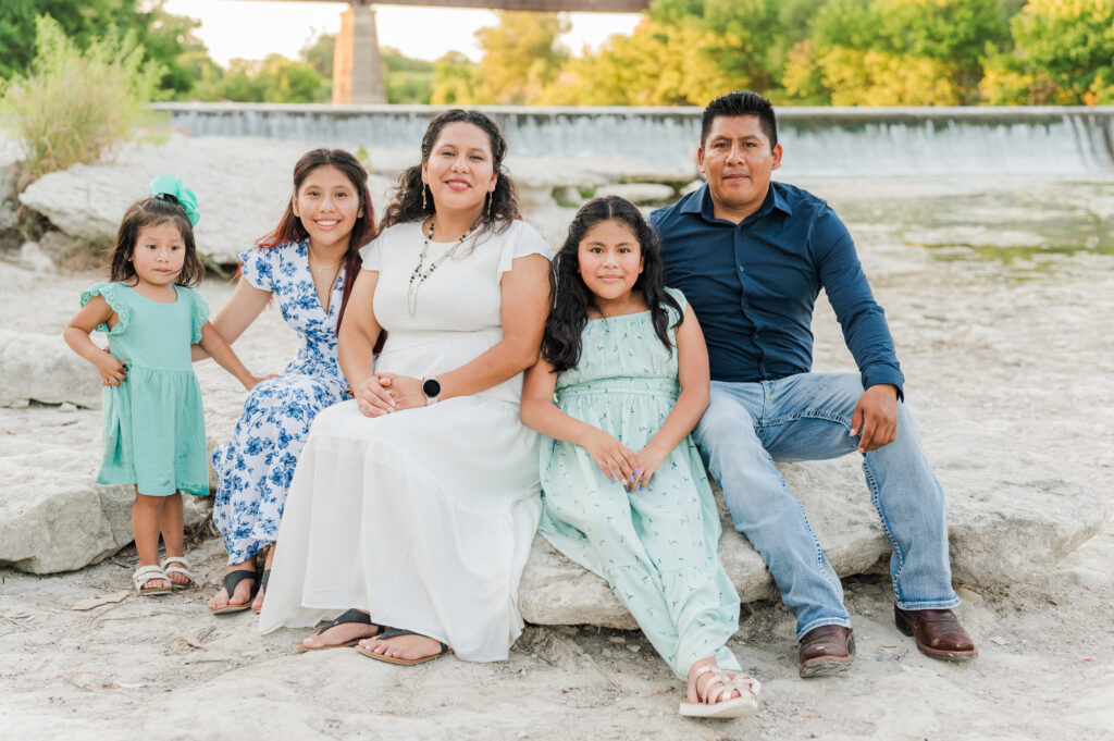 Family portraits by the waterfall below Faust Street Bridge