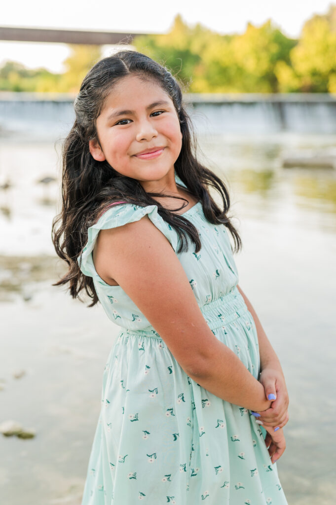 Individual portraits by the water under Faust Street Bridge 