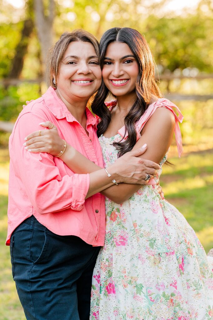 high school senior taking photo with mom