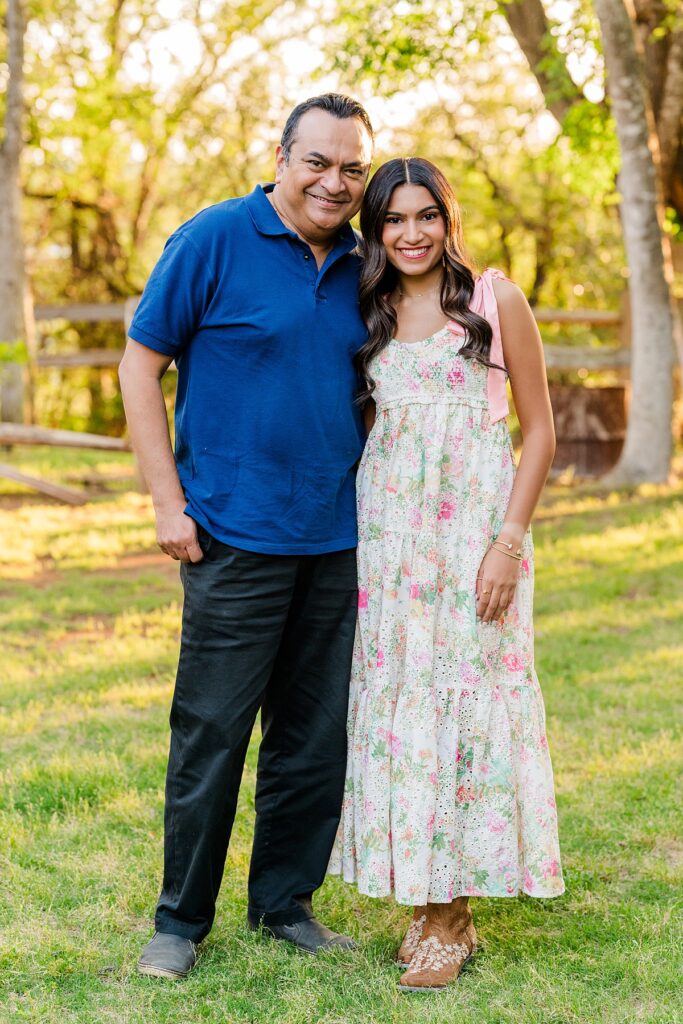 high school senior taking photo with dad