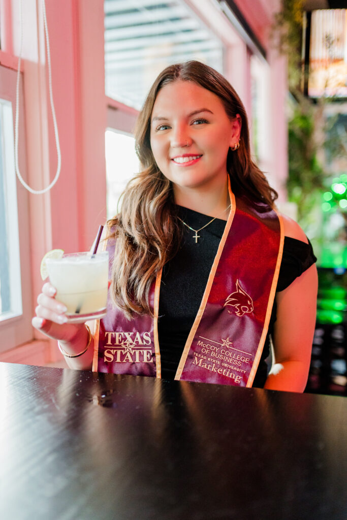 texas state grad photos at bar downtown 